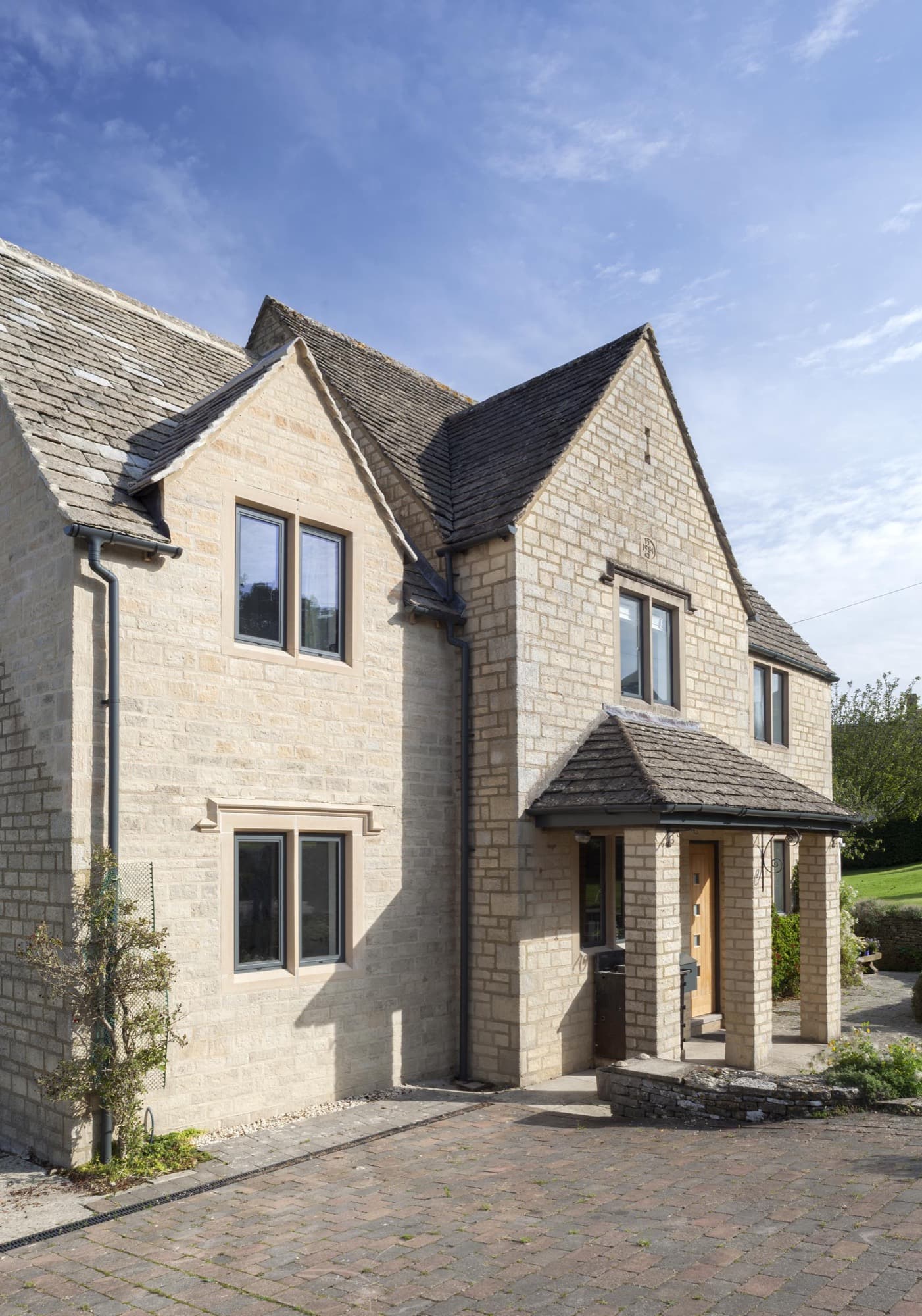 A stone cottage fitted with slim aluminium windows