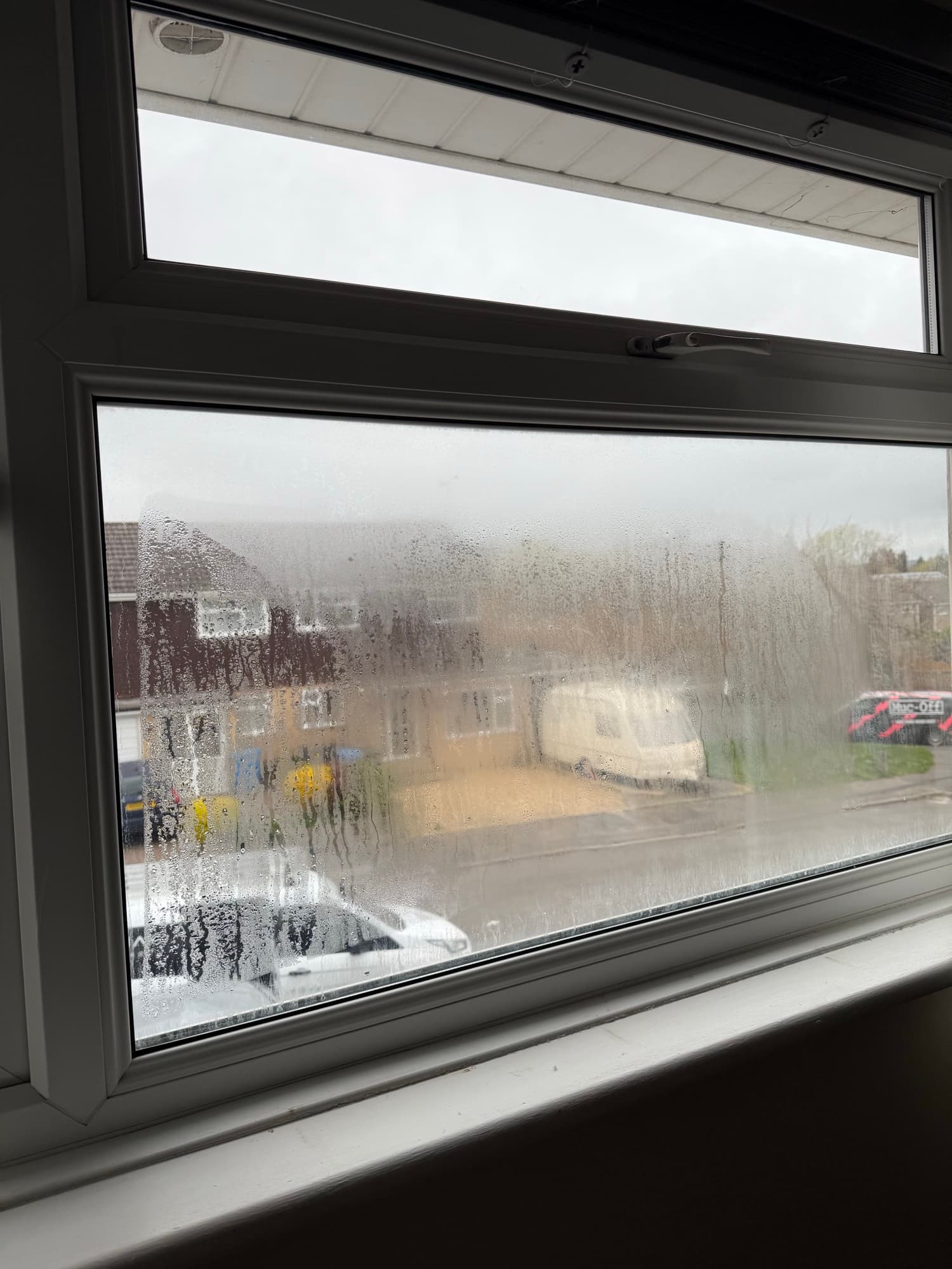 A single failed sealed unit clouded over, the panes beside it still clear