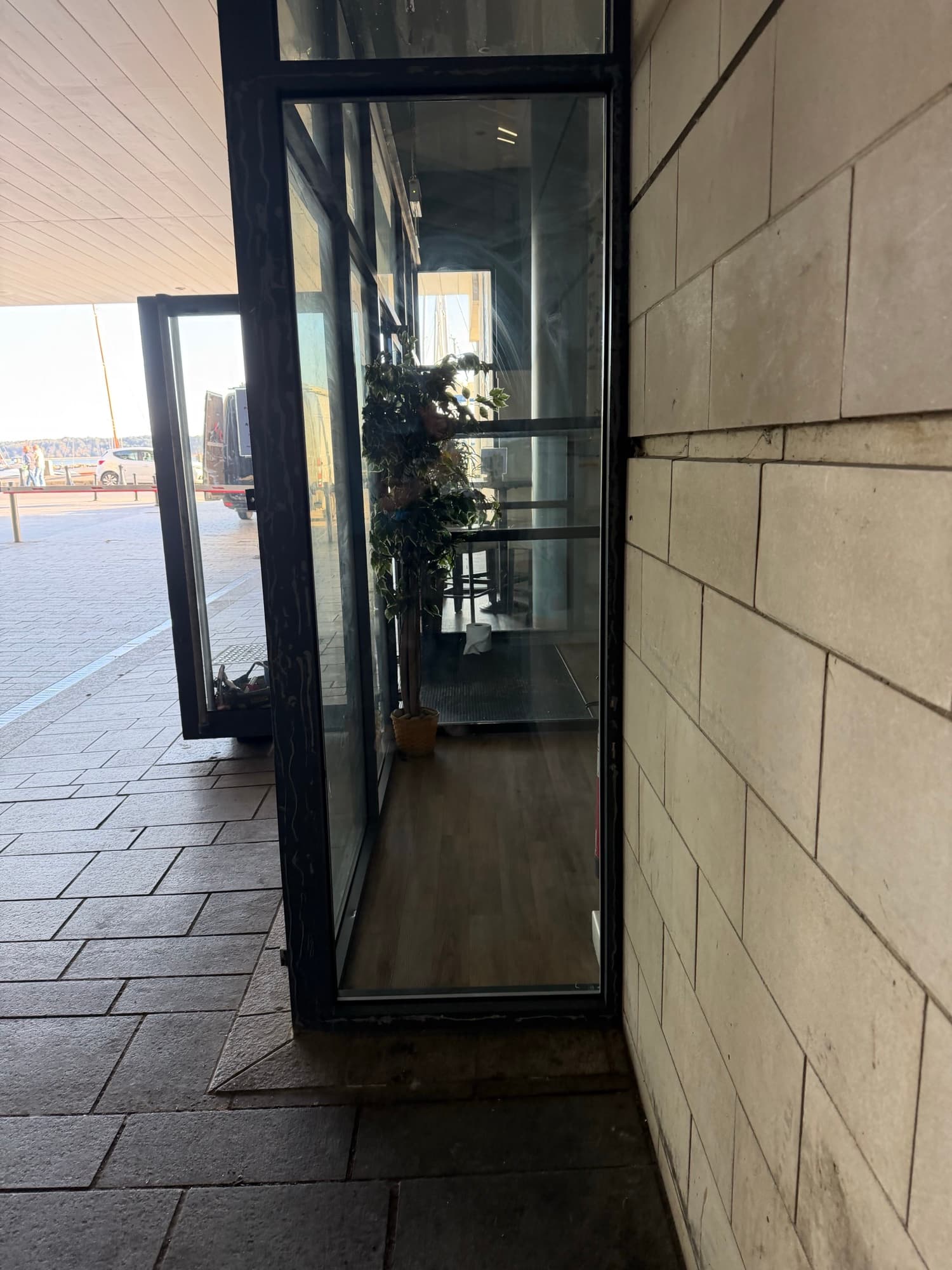 A window with its broken pane replaced, the glass clear and intact