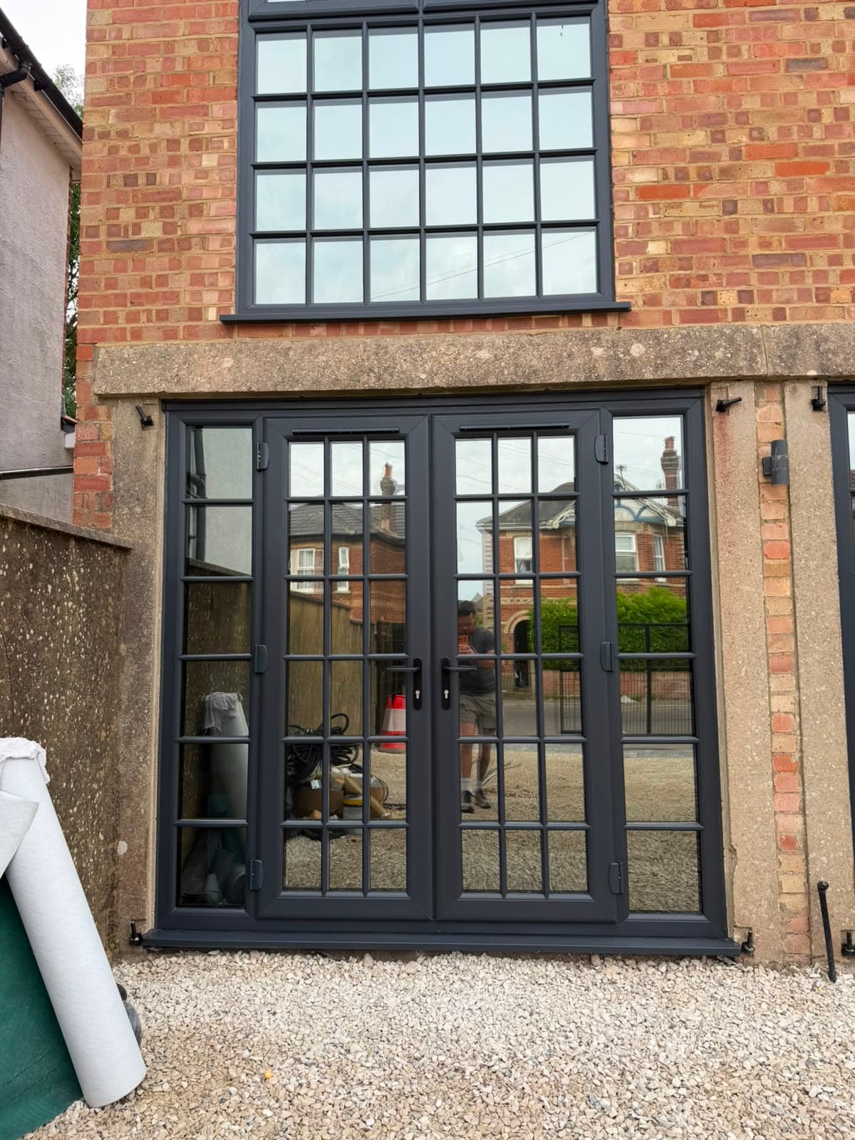 Slim anthracite aluminium sightlines on a heritage elevation, fitted by Wilshaw Glazing